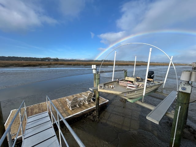 Boat lift with canopy frame over the marsh