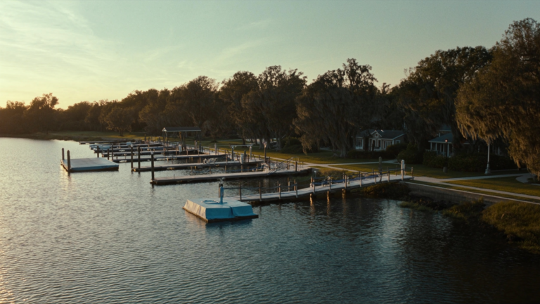 Shared community dock with multiple boat slips on a Lowcountry tidal creek