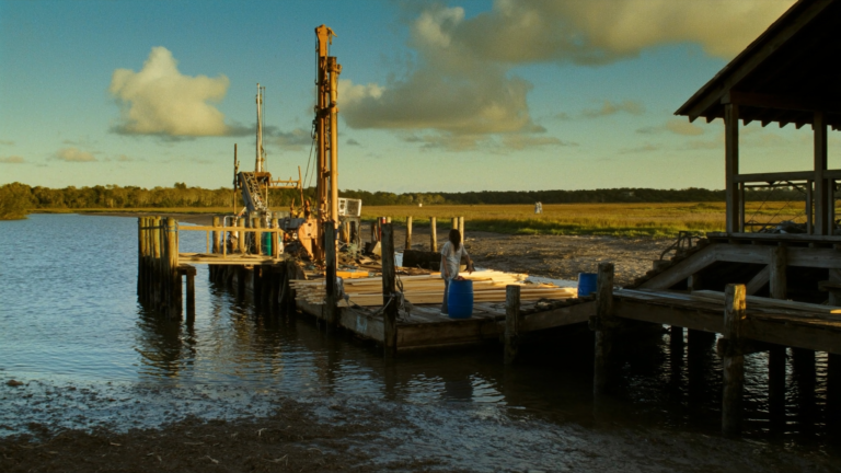 Pile driving barge building a private dock on a Charleston, SC tidal creek