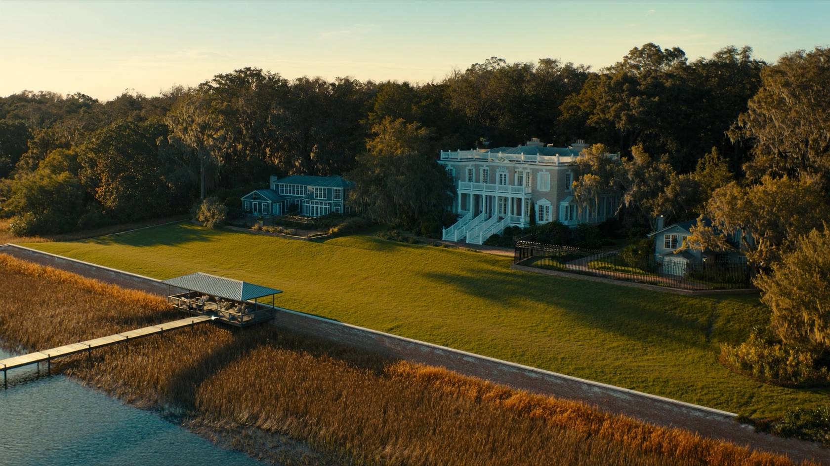 Lowcountry waterfront home with a seawall and private dock near Charleston